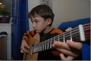 Samir playing guitar, portrait photos 003